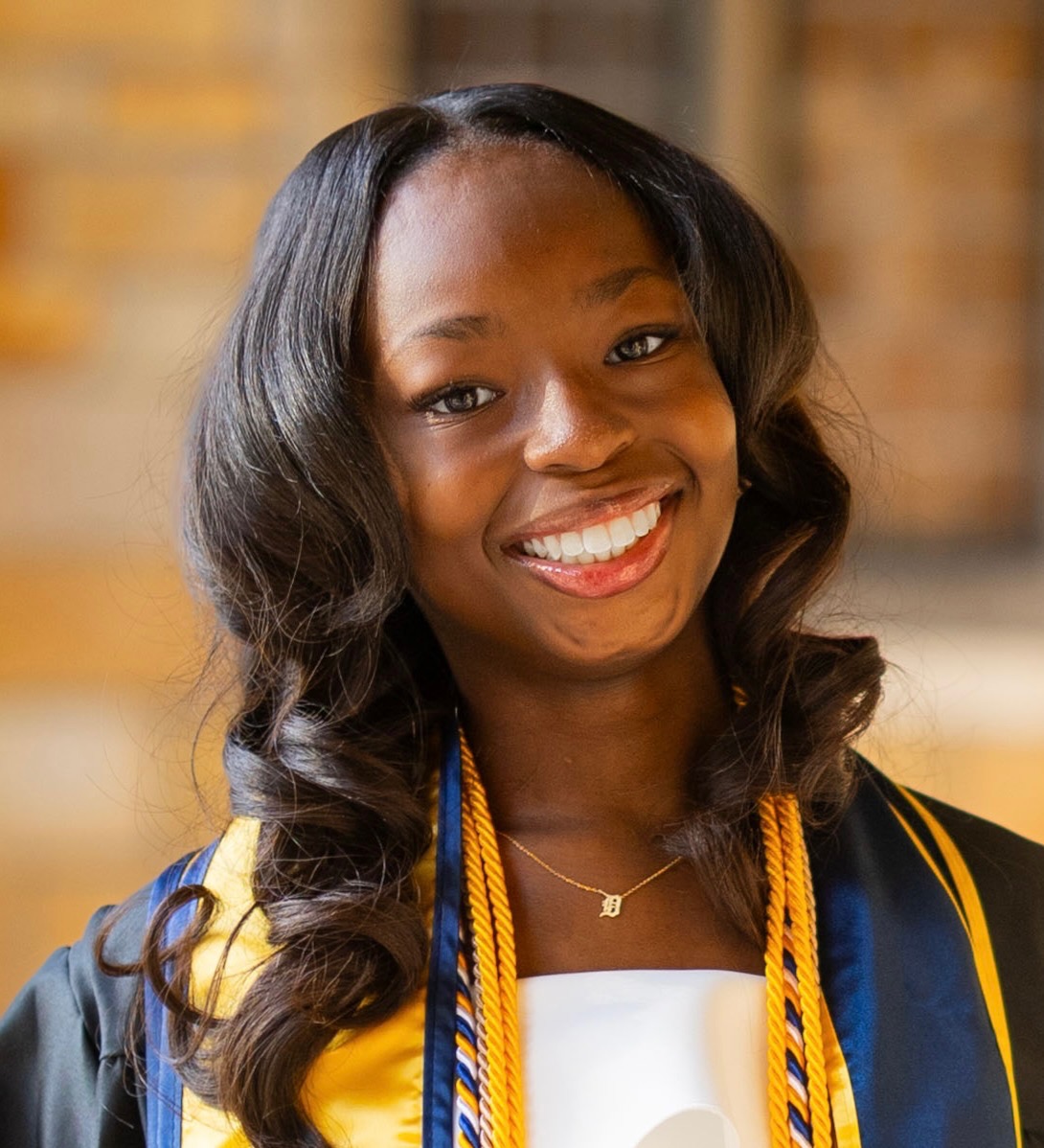 headshot in graduation stole